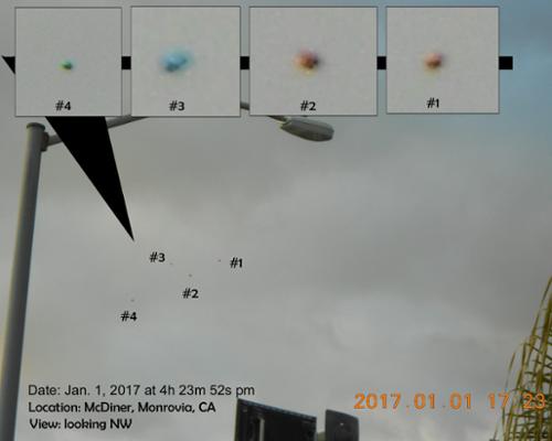 Also known as Image #1679, this is the second photo from the "McDiner UFO Event" of January 1, 2017. Now closer, the four craft show more detail - including splotches that are the distinctive triangular panels visible later. [(c)2017MarianRudnyk. All Rights Reserved.]