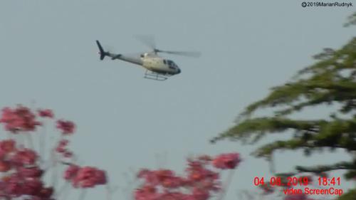 This unmarked military helicopter was one of many helos that furiously circled a large white orb (not visible in this view) that was hovering over our foothill neighborhood. I was able to successfully catch the orb on video. [(c)2019MarianRudnyk. All Rights Reserved.]    
